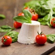 with basil leaves and cherry tomatoes